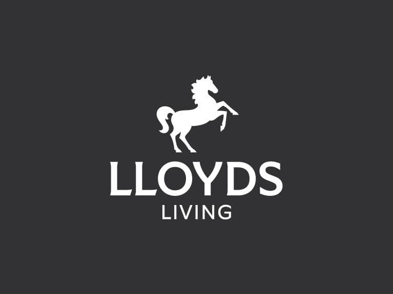 Lloyds Living primary logo reversed has white horse positioned centrally above white 'Lloyds' wording, with 'Living' below.