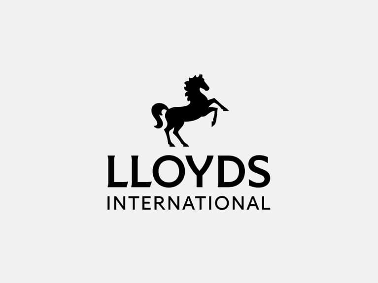Lloyds International primary logo positive has black horse positioned centrally above 'Lloyds', with 'International' below.