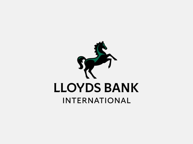 Lloyds Bank International primary logo positive has black horse with green highlights positioned centrally above 'Lloyds Bank', with 'International' smaller below.