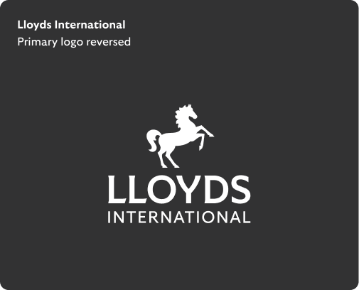 Lloyds International primary logo reversed has white horse positioned centrally above white 'Lloyds' wording, with 'International' below.